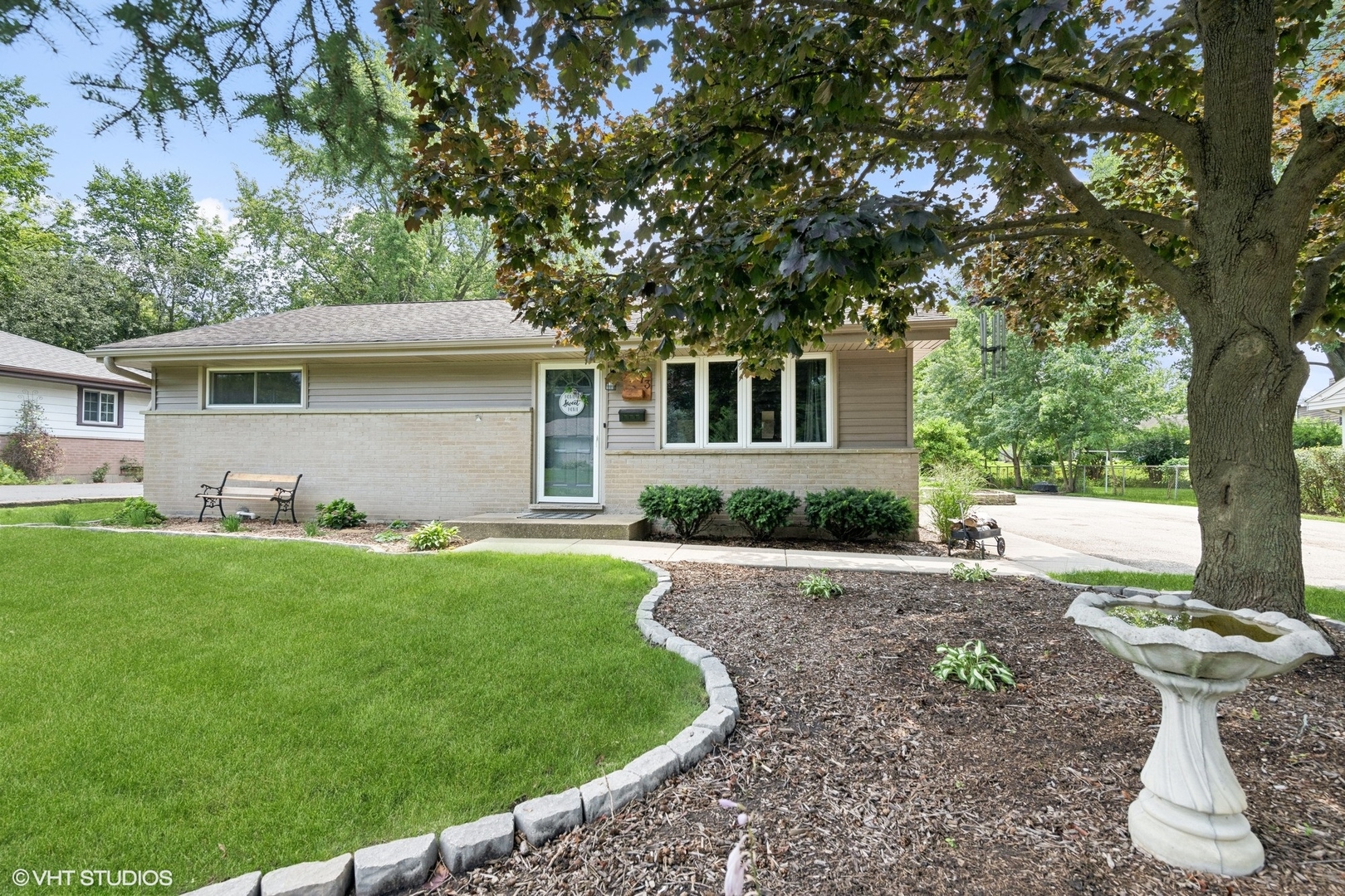 front view of a house with a yard