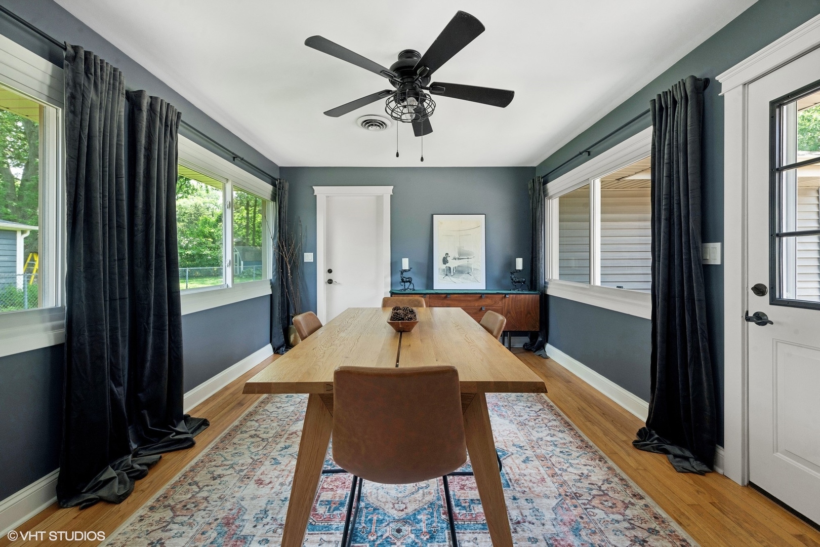 73 Golfview Road Lake Zurich, IL 60047 - Photo 11 of 34 a dining room with wooden floor and a rug