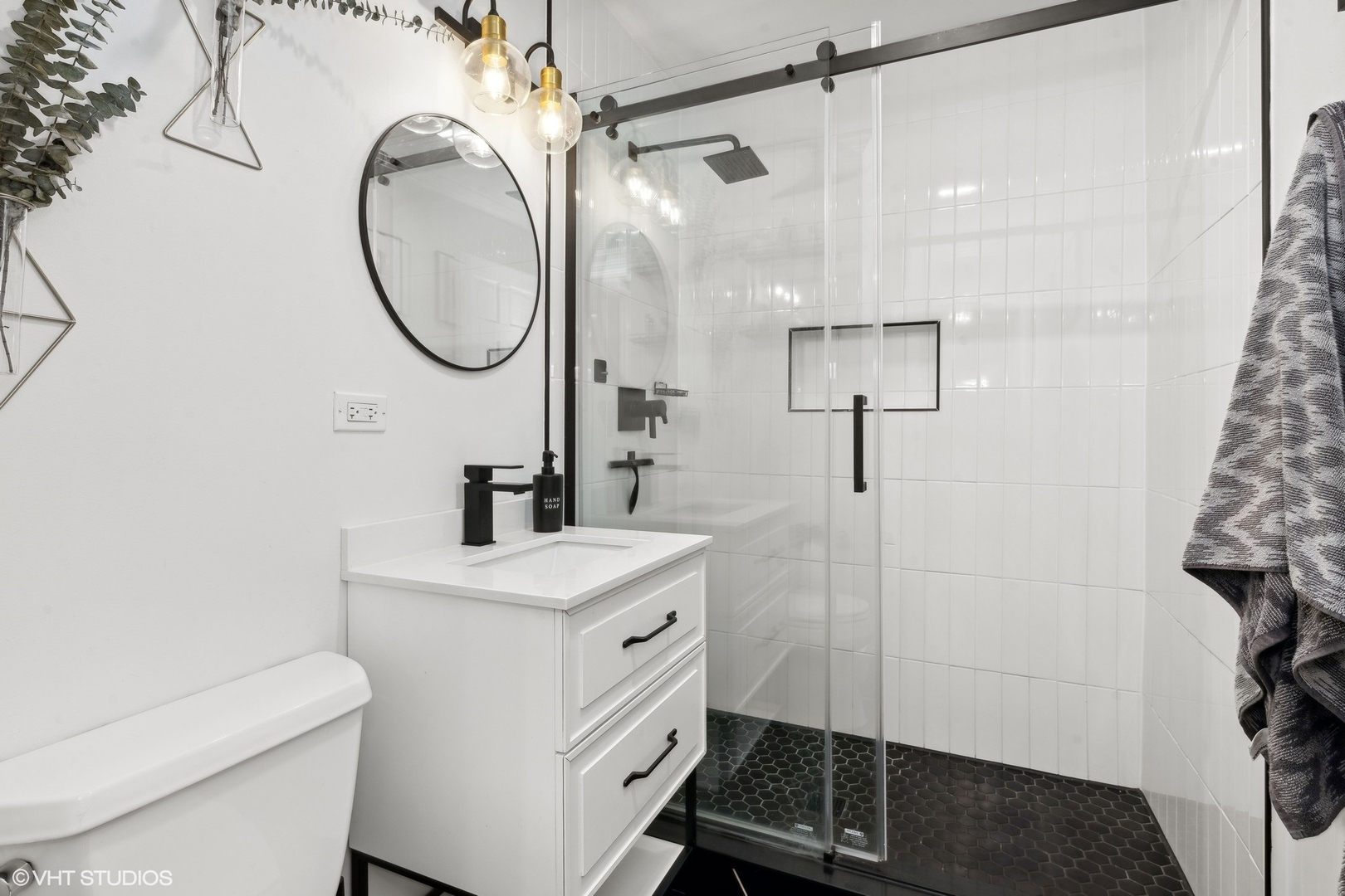 73 Golfview Road Lake Zurich, IL 60047 - Photo 17 of 34 a bathroom with a sink a toilet and a mirror