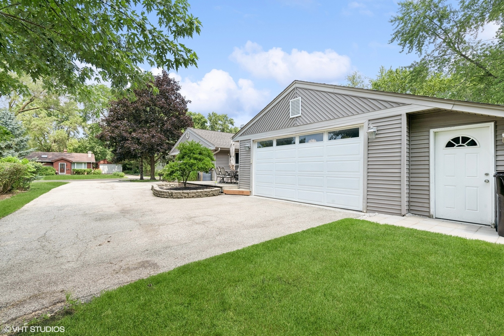 73 Golfview Road Lake Zurich, IL 60047 - Photo 24 of 34 a view of a house with a yard and garage