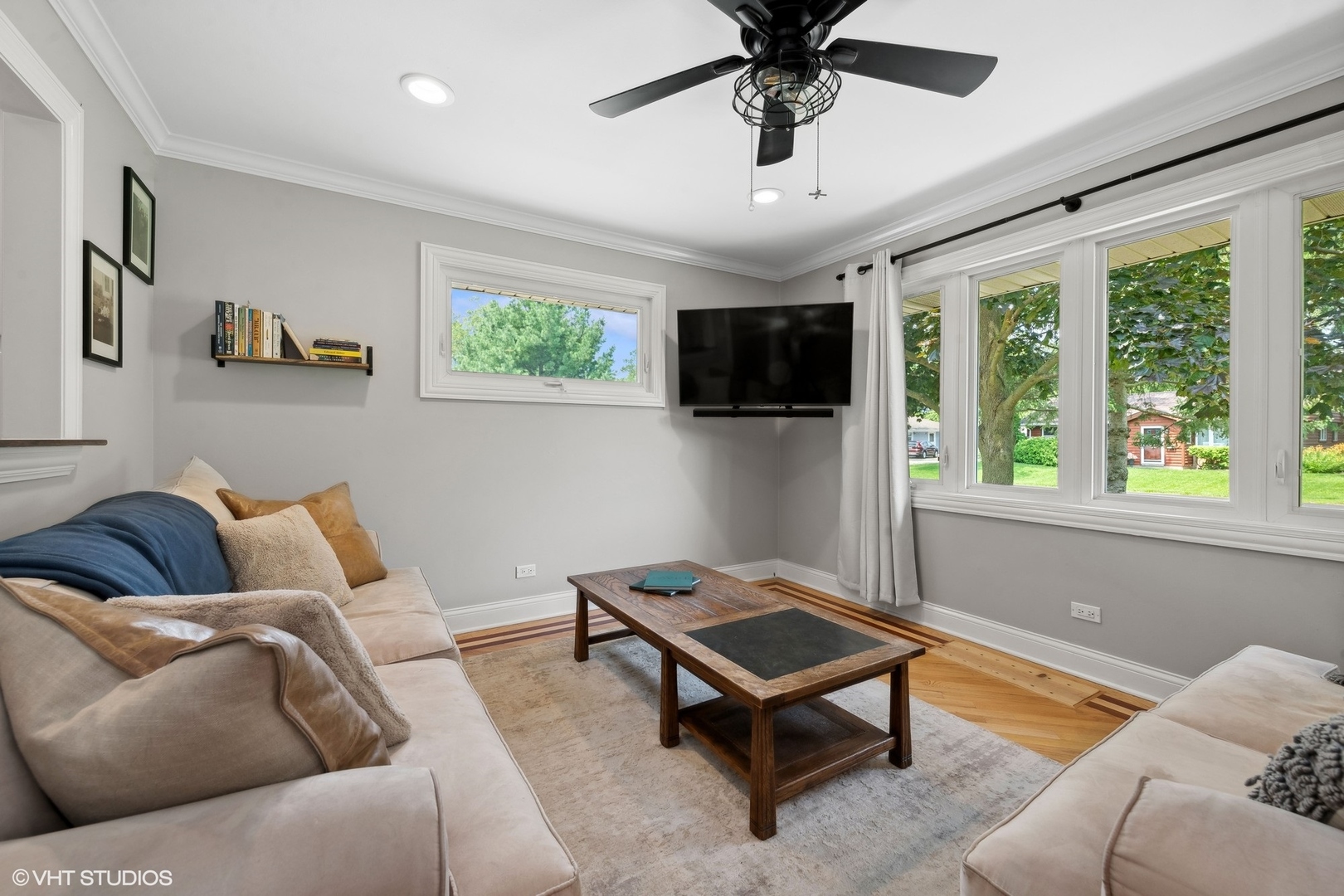 73 Golfview Road Lake Zurich, IL 60047 - Photo 7 of 34 a living room with furniture a ceiling fan and a window