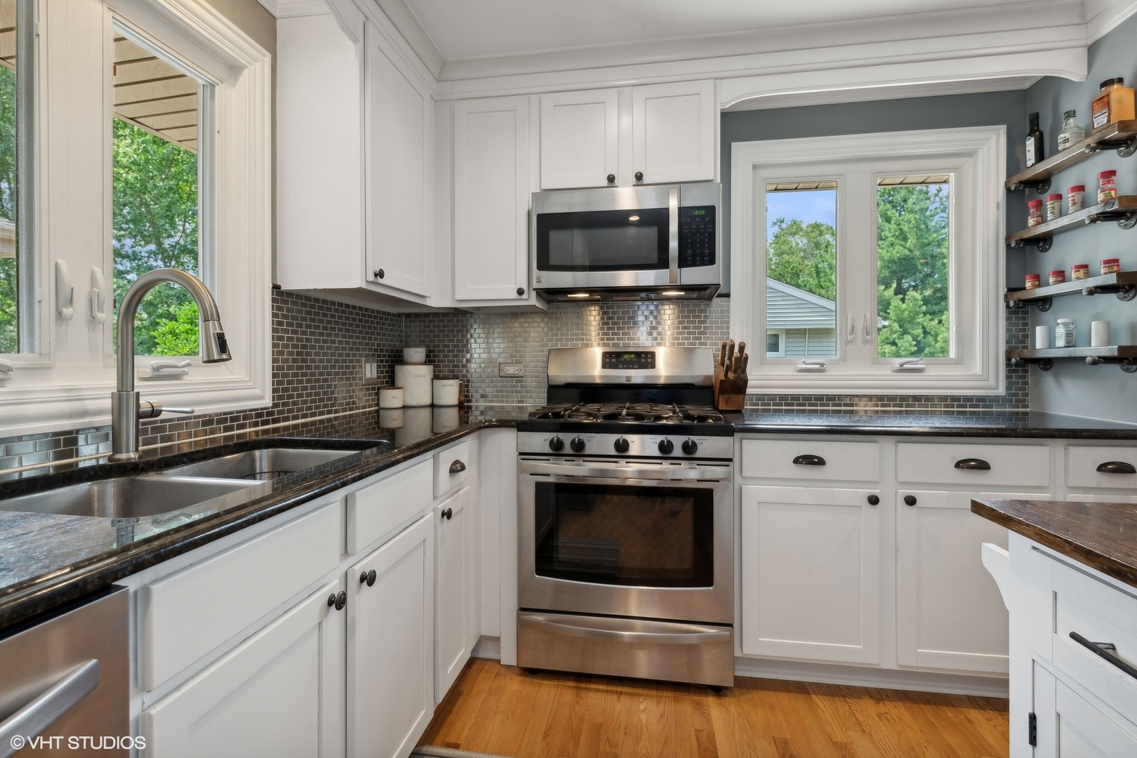 73 Golfview Road Lake Zurich, IL 60047 - Photo 9 of 34 a kitchen with granite countertop white cabinets appliances a sink and a window