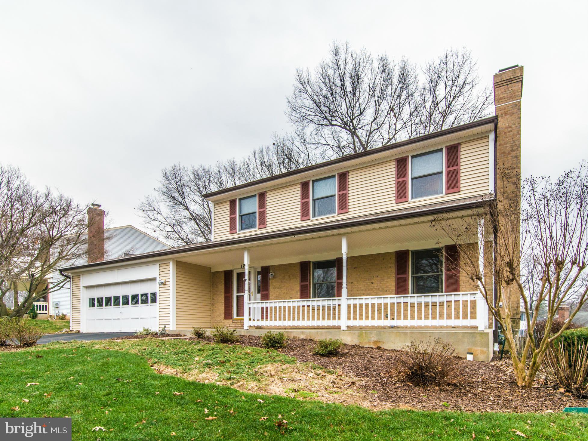 127 Summit Hall Road Gaithersburg, MD 20877 - Photo 2 of 30 a front view of a house with garden