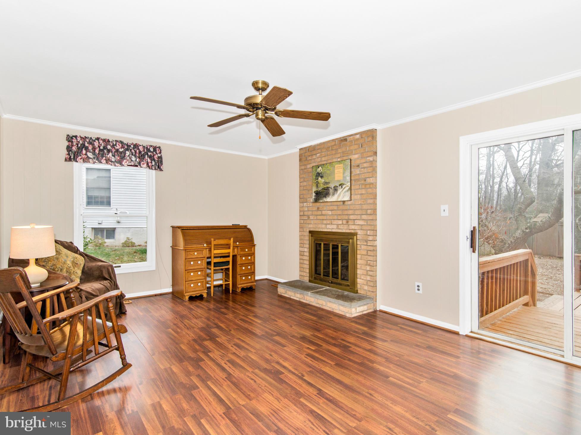127 Summit Hall Road Gaithersburg, MD 20877 - Photo 15 of 30 a living room with furniture and a fireplace