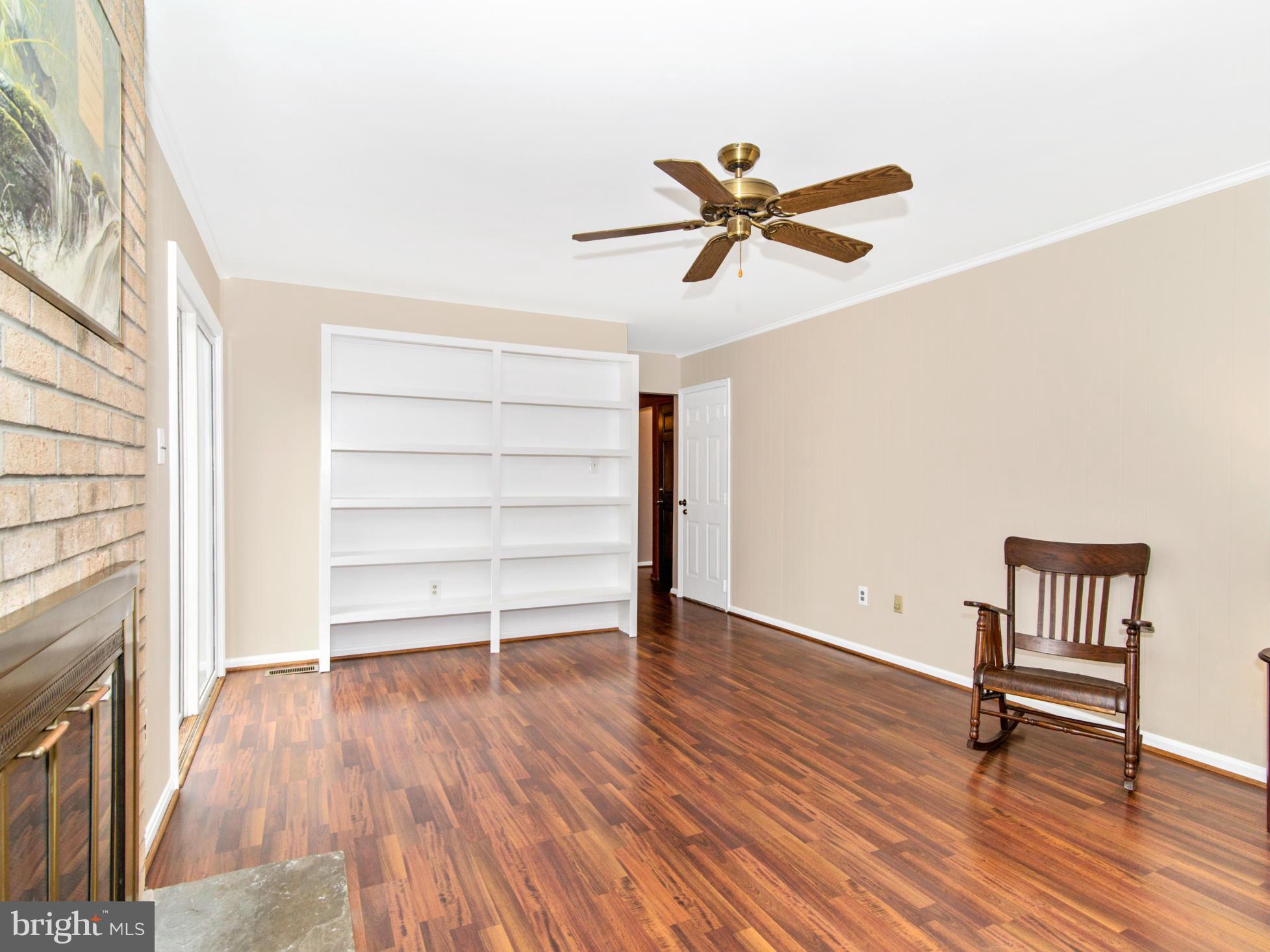 127 Summit Hall Road Gaithersburg, MD 20877 - Photo 17 of 30 a view of a livingroom with wooden floor and a ceiling fan
