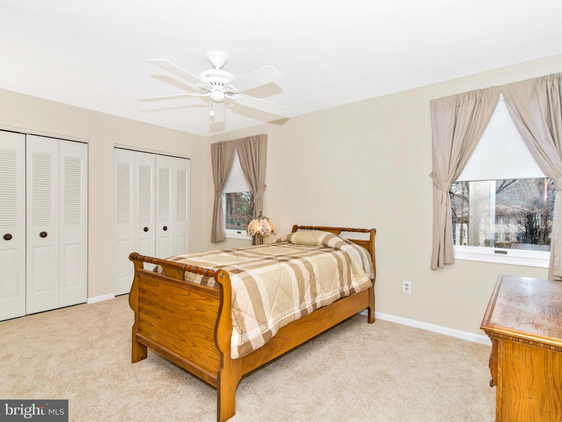 127 Summit Hall Road Gaithersburg, MD 20877 - Photo 22 of 30 a spacious bedroom with a bed and a window