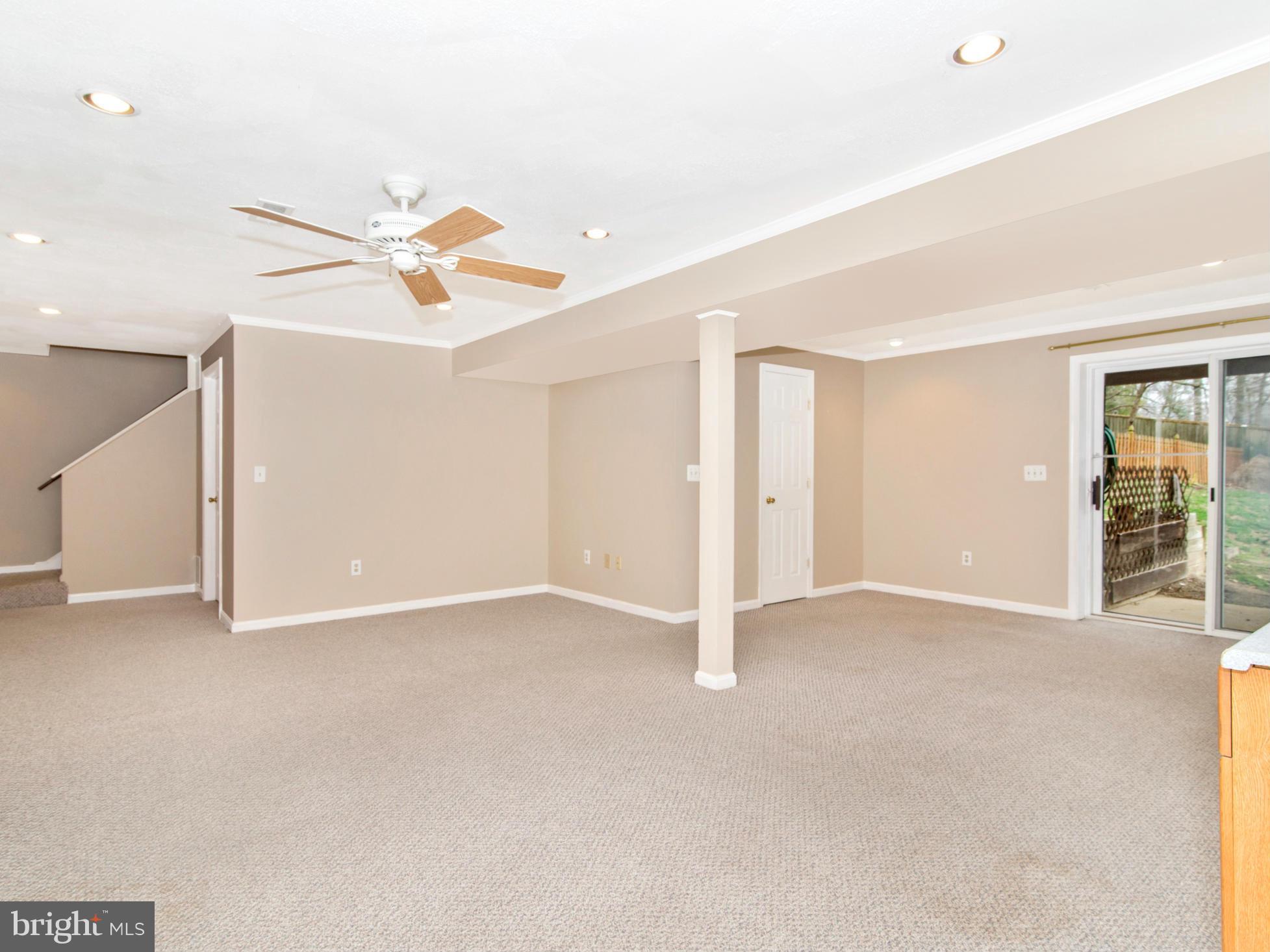 127 Summit Hall Road Gaithersburg, MD 20877 - Photo 24 of 30 an empty room with closet and a chandelier fan