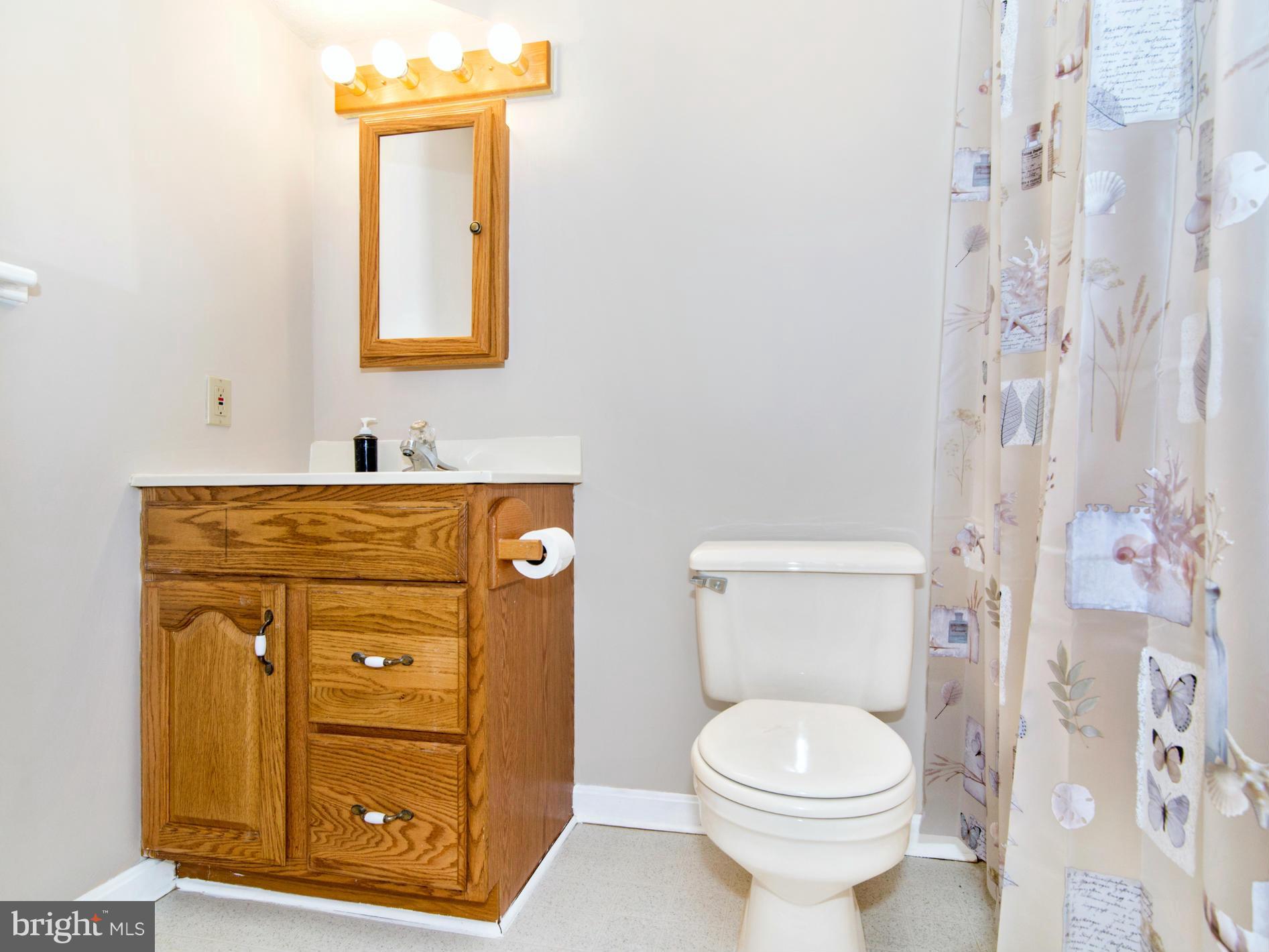 127 Summit Hall Road Gaithersburg, MD 20877 - Photo 27 of 30 a bathroom with a sink toilet and shower