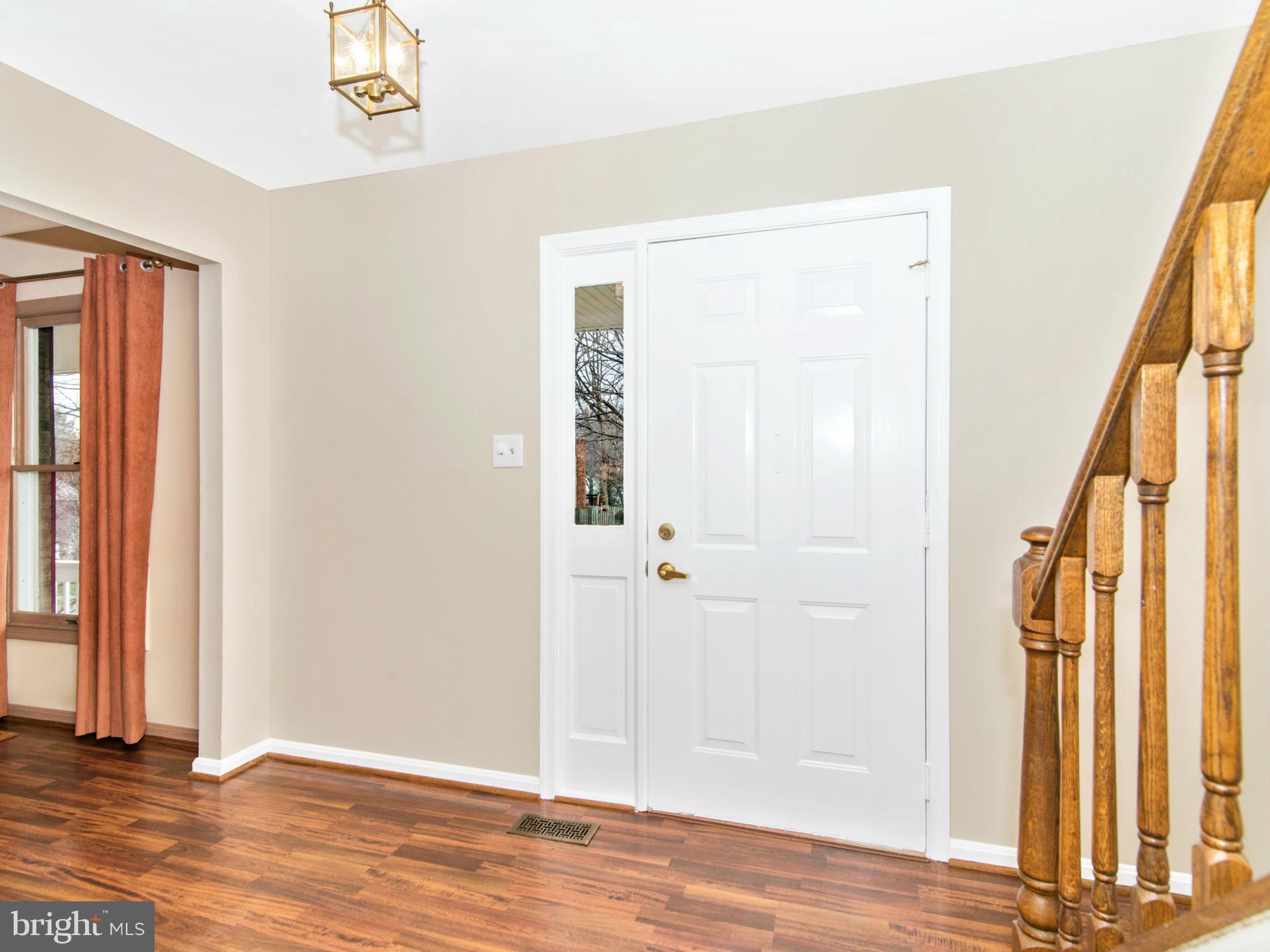 127 Summit Hall Road Gaithersburg, MD 20877 - Photo 4 of 30 an empty room with wooden floor and windows