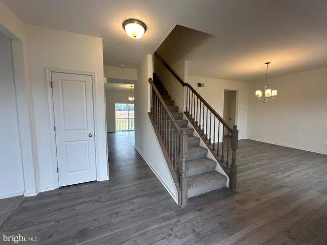 a view of entryway with wooden floor