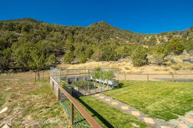 a view of a chairs and table on the terrace