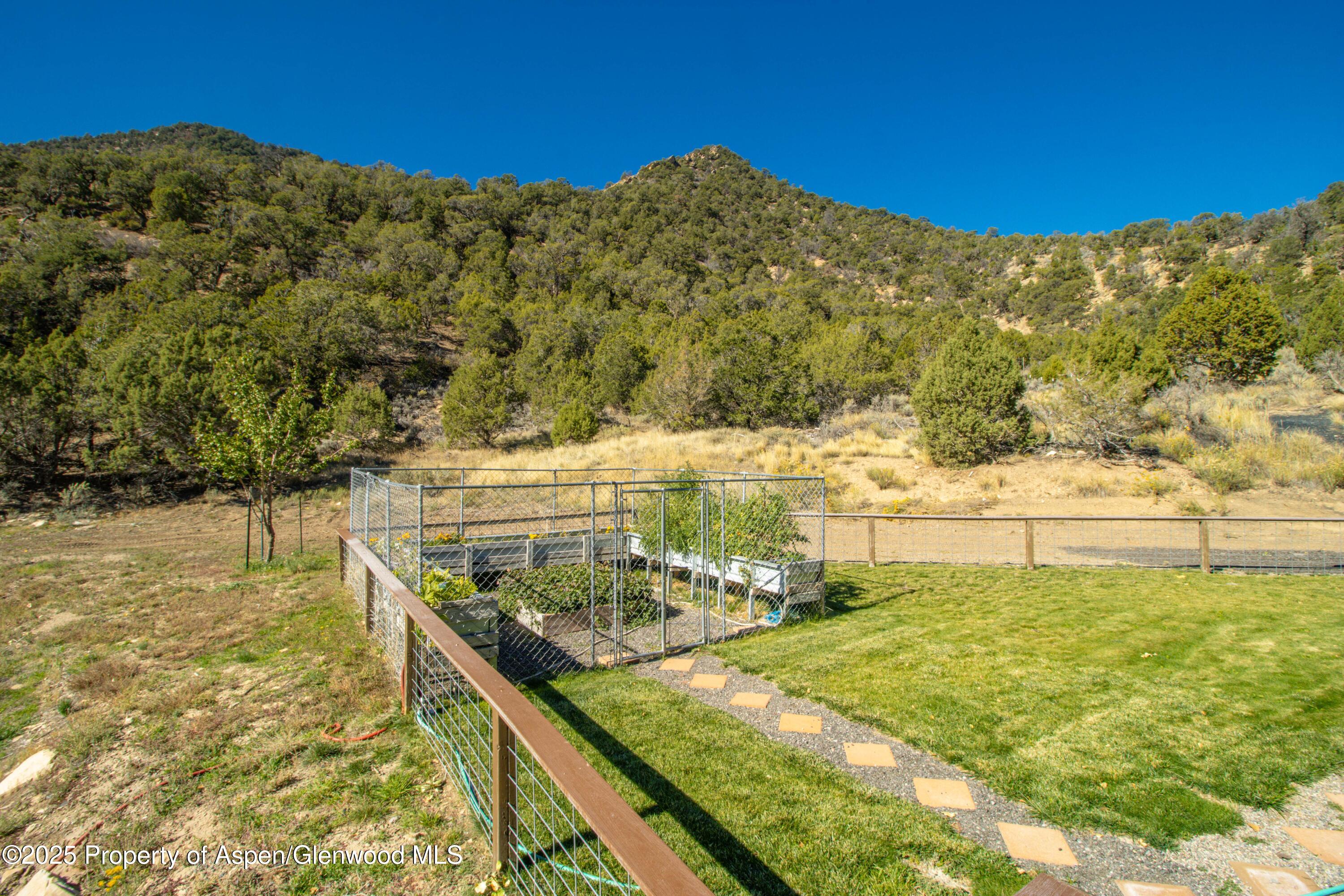 3211 County Road 237 Rifle, CO 81650 - Photo 13 of 56 a view of a swimming pool with a yard