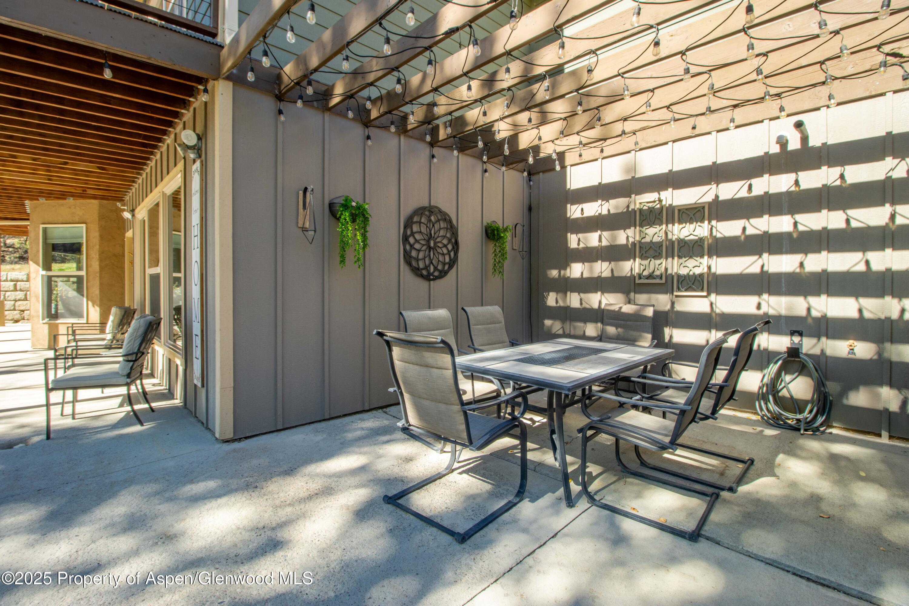 3211 County Road 237 Rifle, CO 81650 - Photo 16 of 56 a view of a chairs and table in a patio
