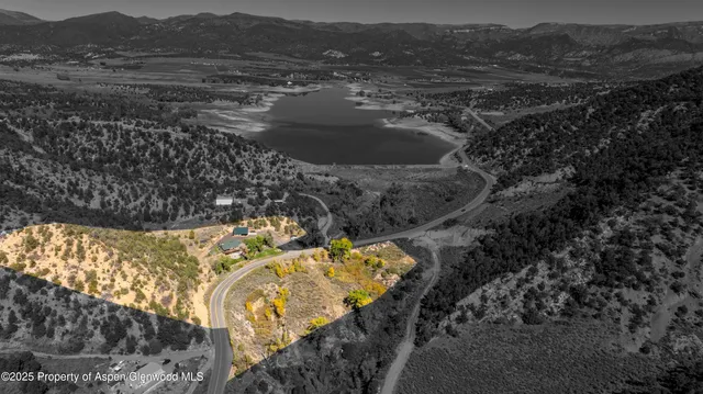 a view of ocean with a mountain