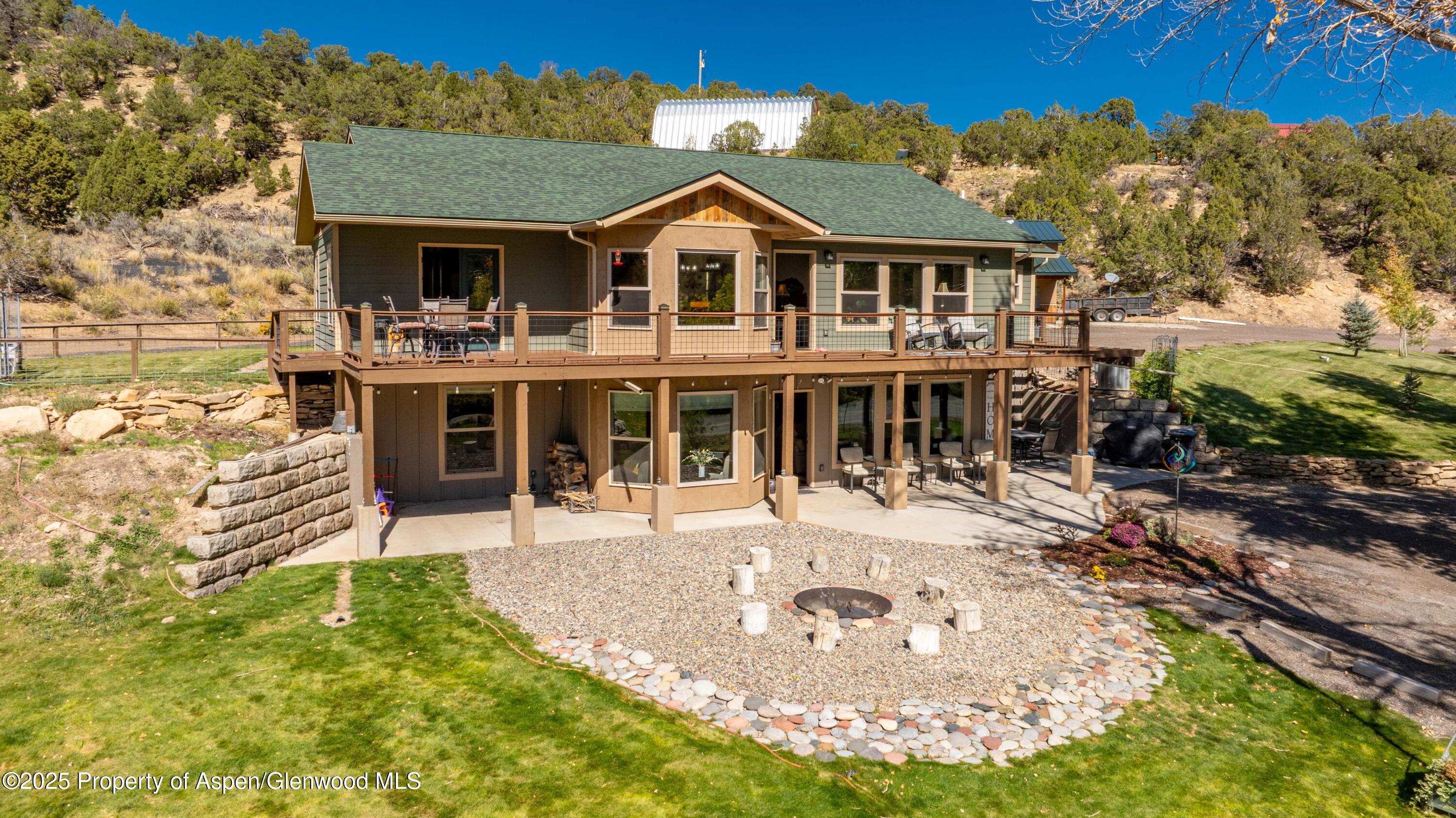 3211 County Road 237 Rifle, CO 81650 - Photo 2 of 56 a front view of a house with a yard