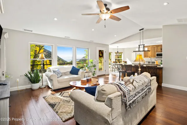 a kitchen with stainless steel appliances kitchen island granite countertop a sink and cabinets