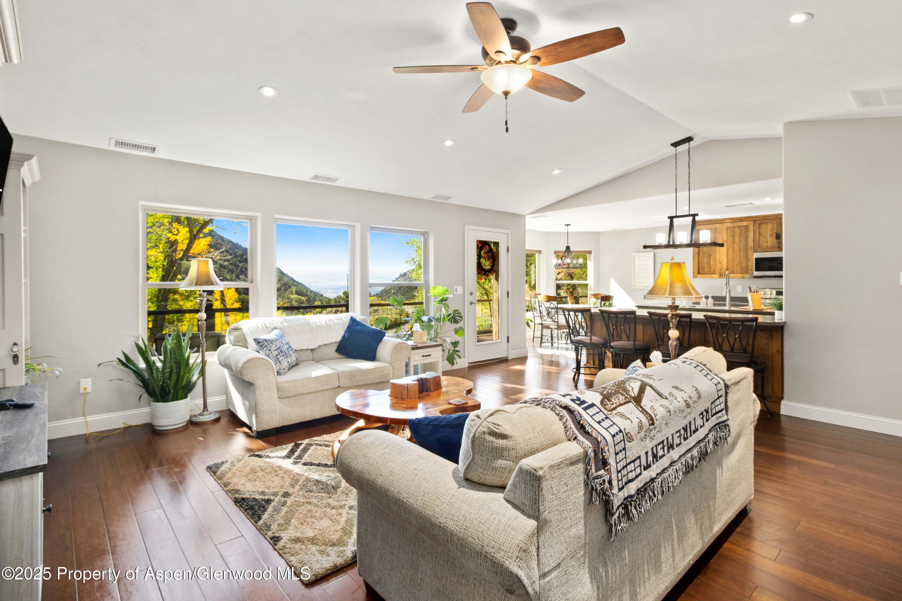 3211 County Road 237 Rifle, CO 81650 - Photo 23 of 56 a living room with furniture ceiling fan and a wooden floor