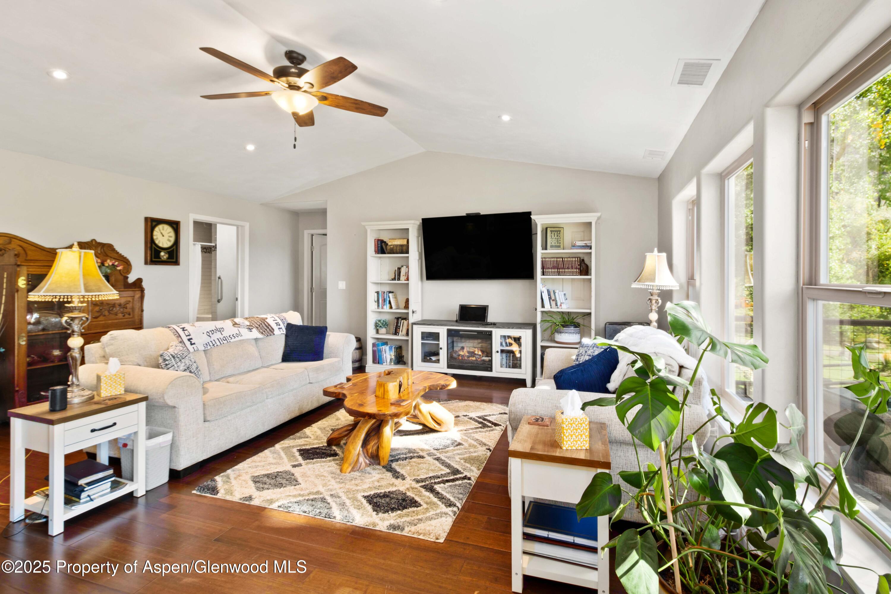 3211 County Road 237 Rifle, CO 81650 - Photo 24 of 56 a living room with furniture a flat screen tv and a large window