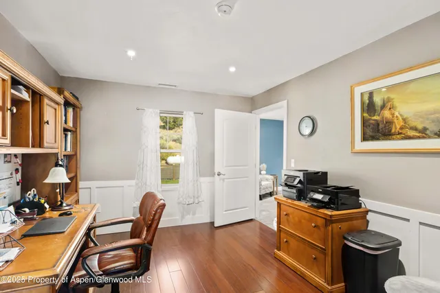 a view of walk in closet with clothes
