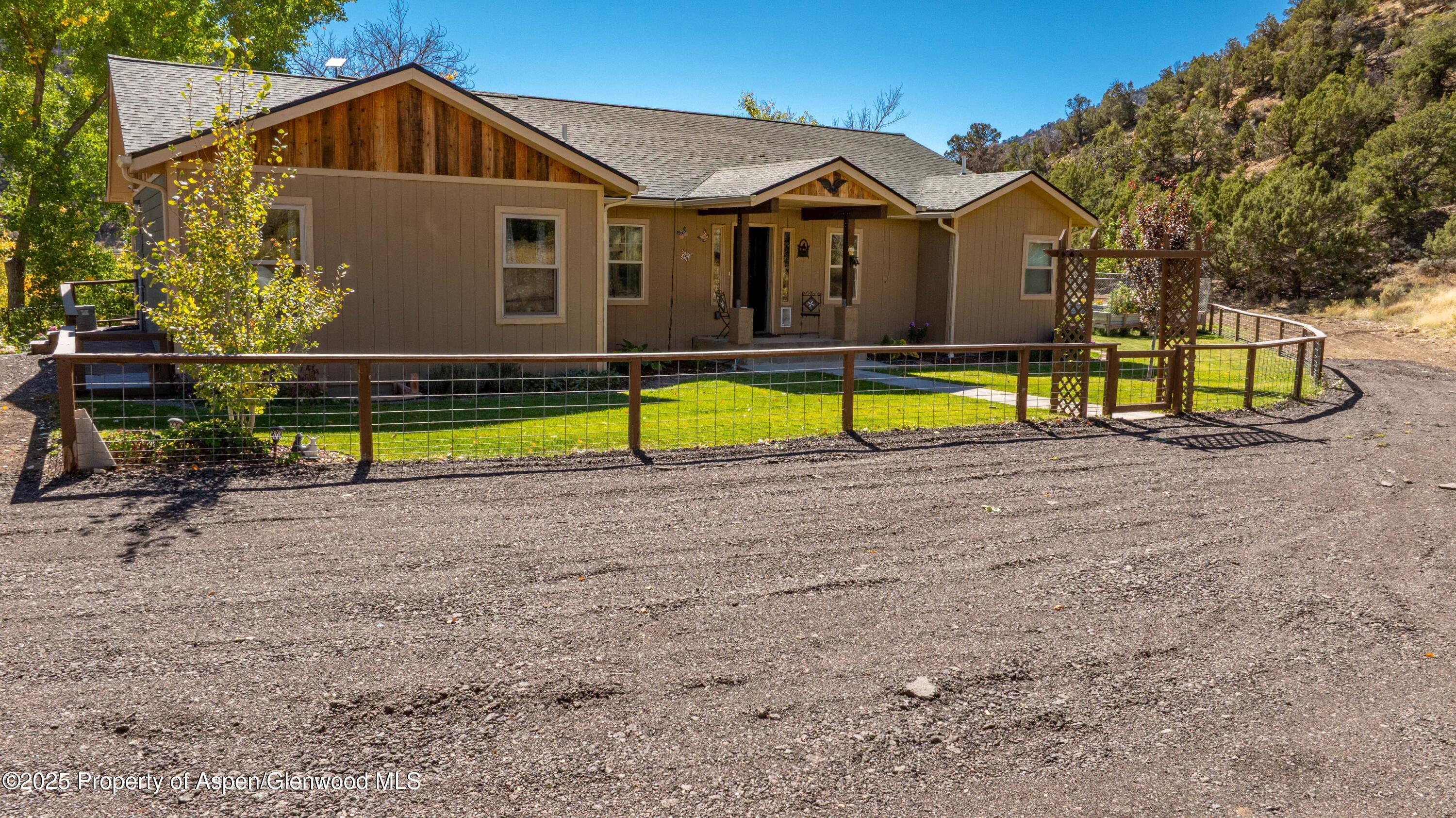 3211 County Road 237 Rifle, CO 81650 - Photo 4 of 56 a view of a house with a yard and swimming pool