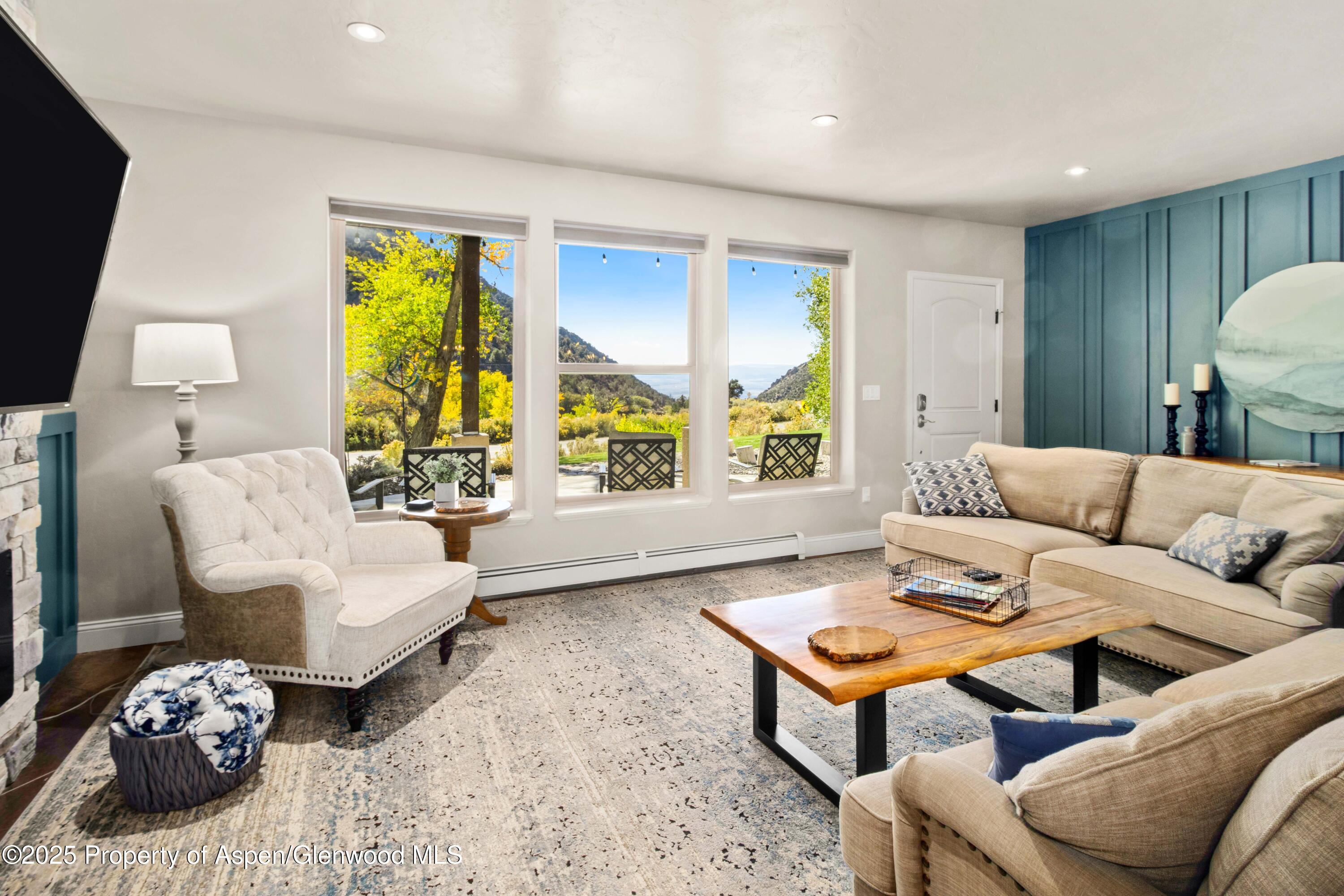 3211 County Road 237 Rifle, CO 81650 - Photo 41 of 56 a living room with furniture and a large window
