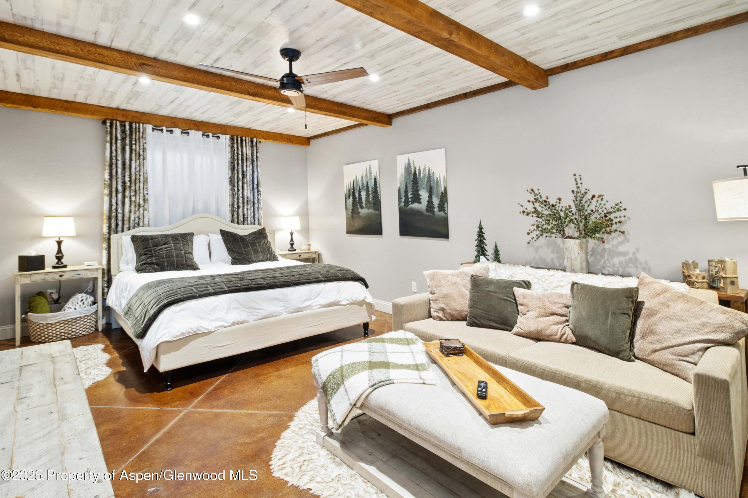 3211 County Road 237 Rifle, CO 81650 - Photo 42 of 56 a bedroom with furniture and a large window