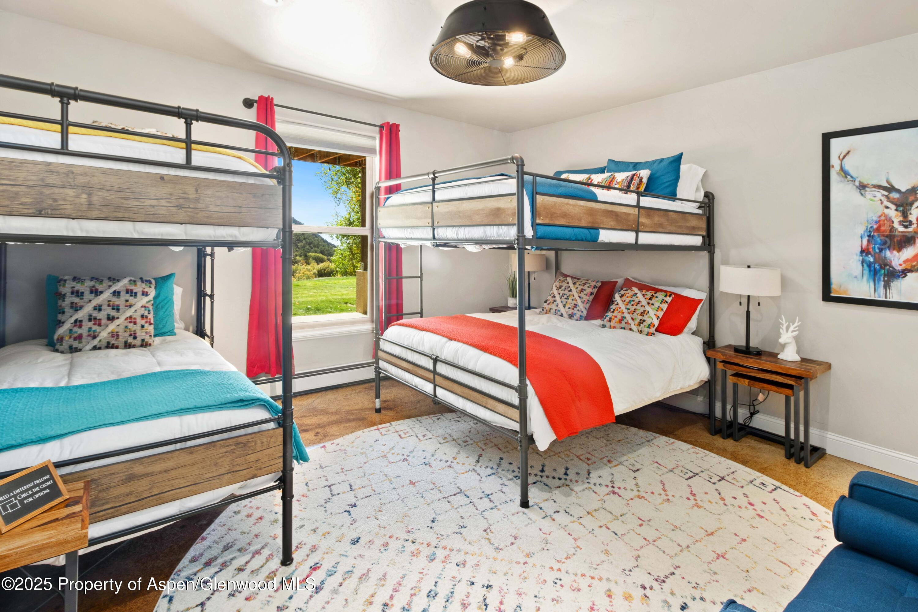 3211 County Road 237 Rifle, CO 81650 - Photo 47 of 56 a bedroom with a bed and a window