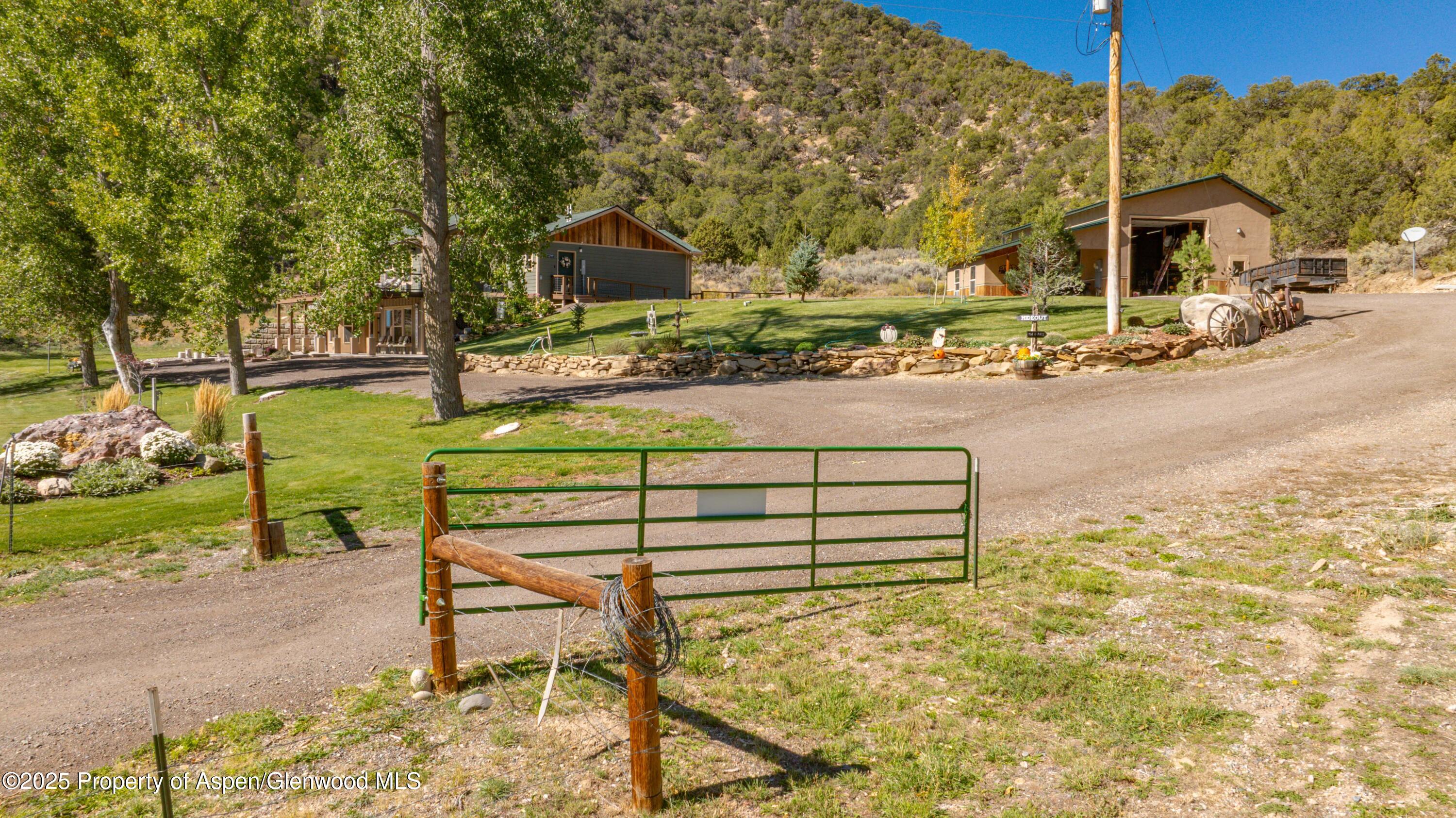 3211 County Road 237 Rifle, CO 81650 - Photo 6 of 56 a view of a bench in the patio next to a yard