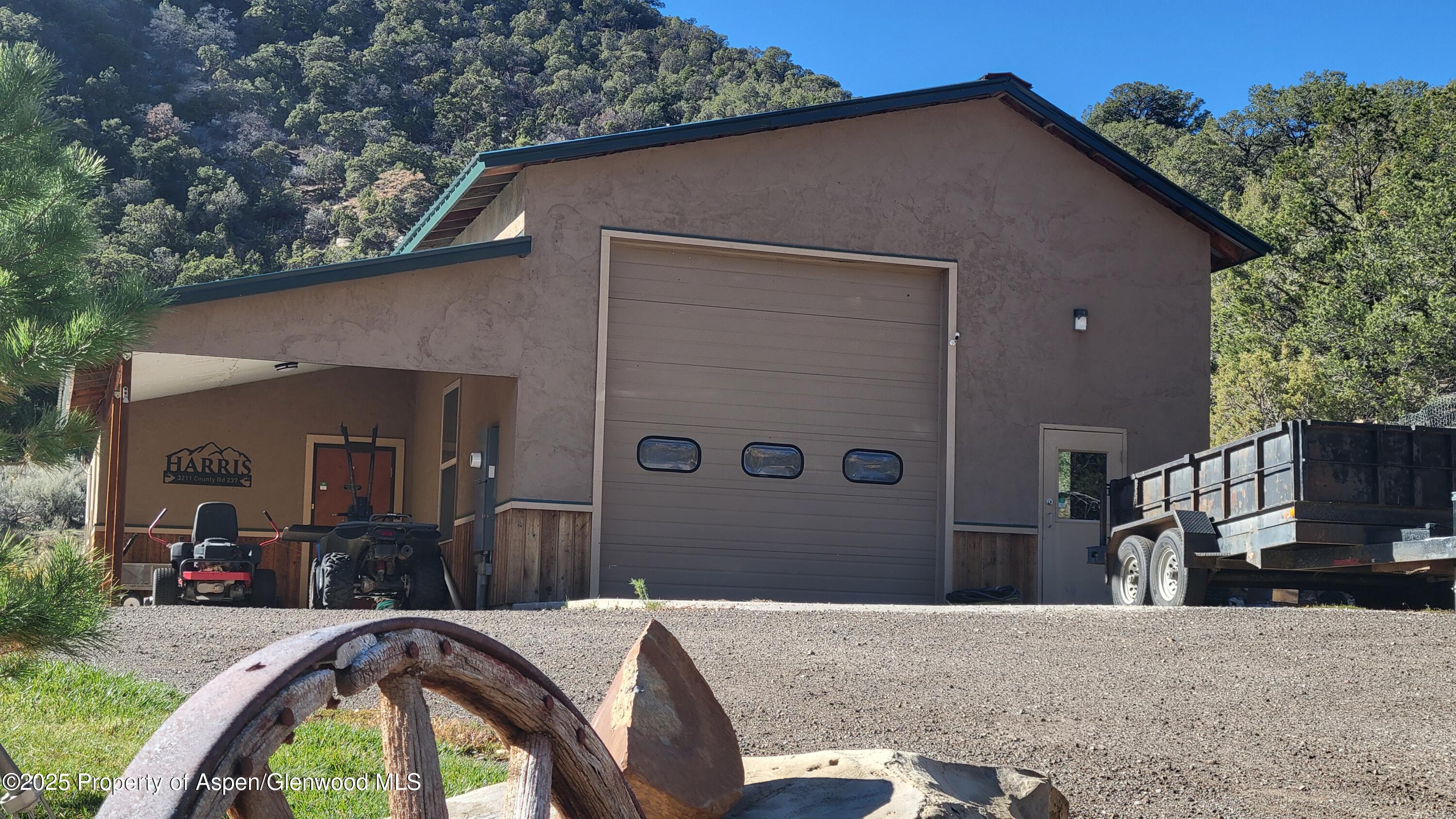3211 County Road 237 Rifle, CO 81650 - Photo 9 of 56 a front view of a house with a yard