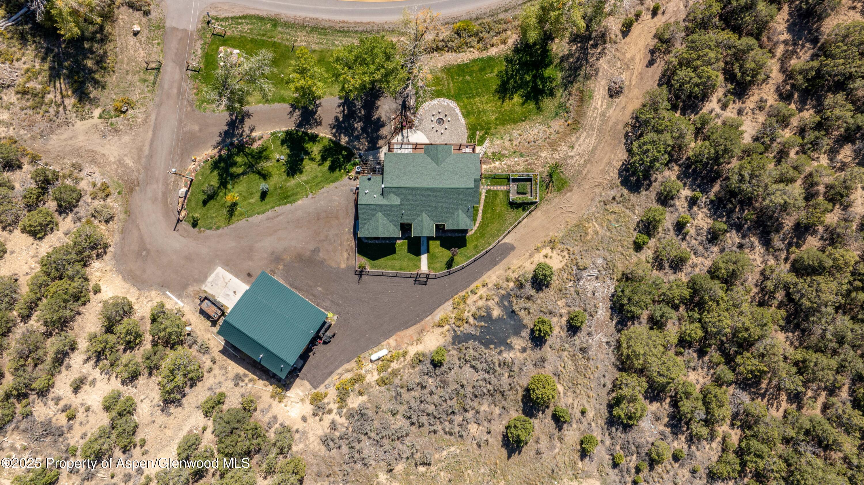 3211 County Road 237 Rifle, CO 81650 - Photo 10 of 56 view of a house with a yard and sitting area