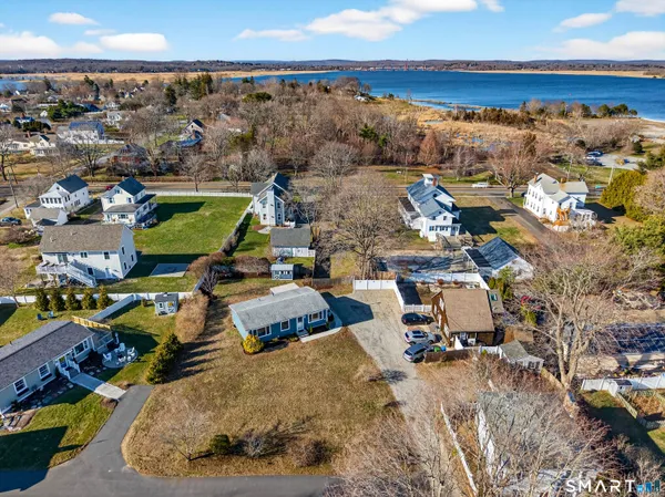 an aerial view of a house with a ocean view