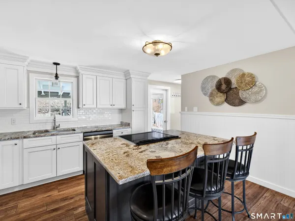 a view of a dining room and kitchen