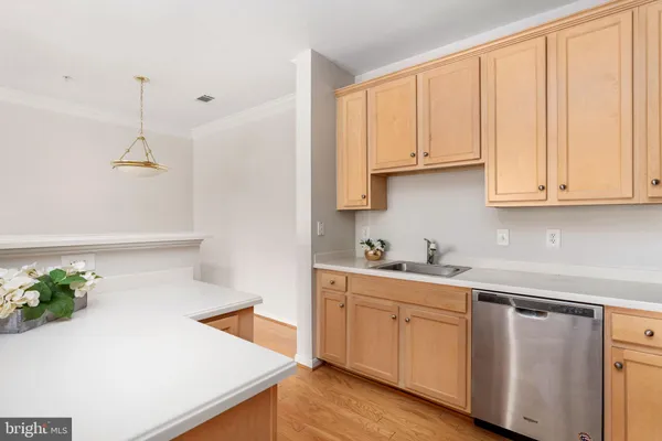 a kitchen with granite countertop a refrigerator stove and microwave