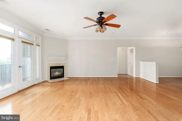 a kitchen with stainless steel appliances granite countertop a sink a refrigerator and a counter top space