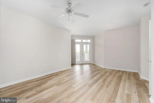 a bathroom with a double vanity sink toilet and mirror