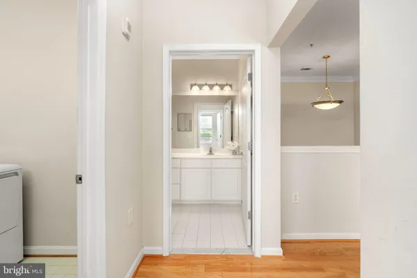 a bathroom with a shower a toilet and white tub