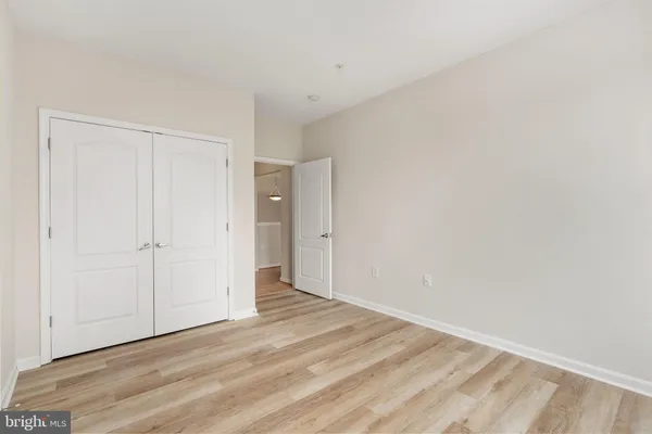 a view of a bedroom from a hallway
