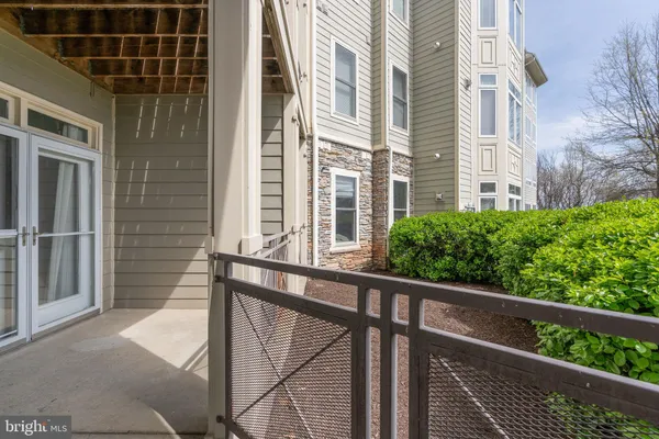 a large parking space with a lot of buildings in the background