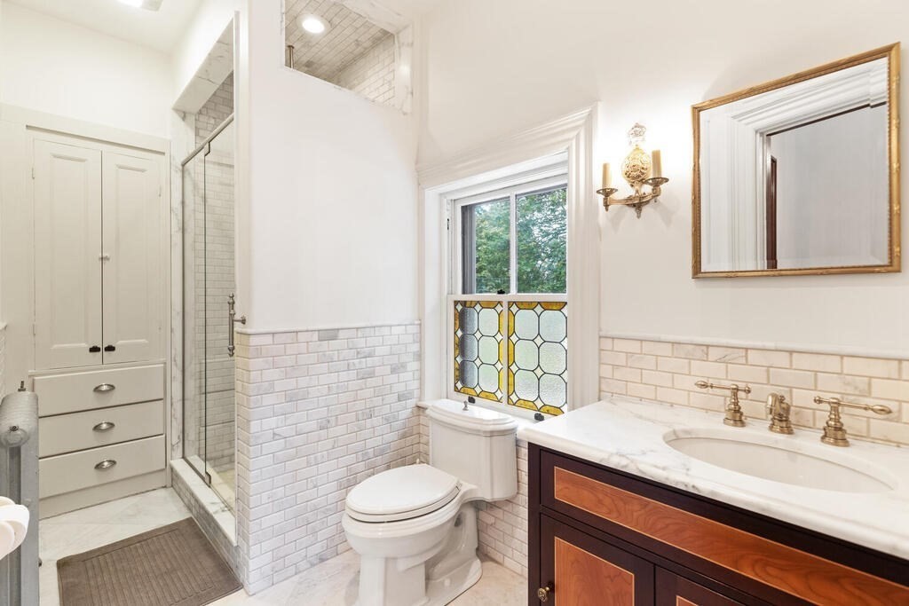 2 Rangeley Road, Unit 2 Winchester, MA 01890 - Photo 16 of 29 a bathroom with a granite countertop sink toilet and shower