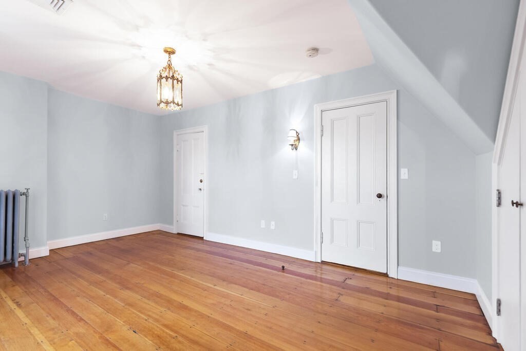 2 Rangeley Road, Unit 2 Winchester, MA 01890 - Photo 19 of 29 a view of empty room with wooden floor and window
