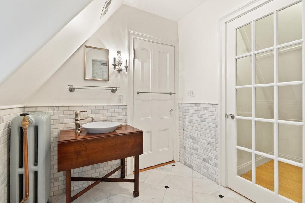 2 Rangeley Road, Unit 2 Winchester, MA 01890 - Photo 22 of 29 a bathroom with a sink and a mirror