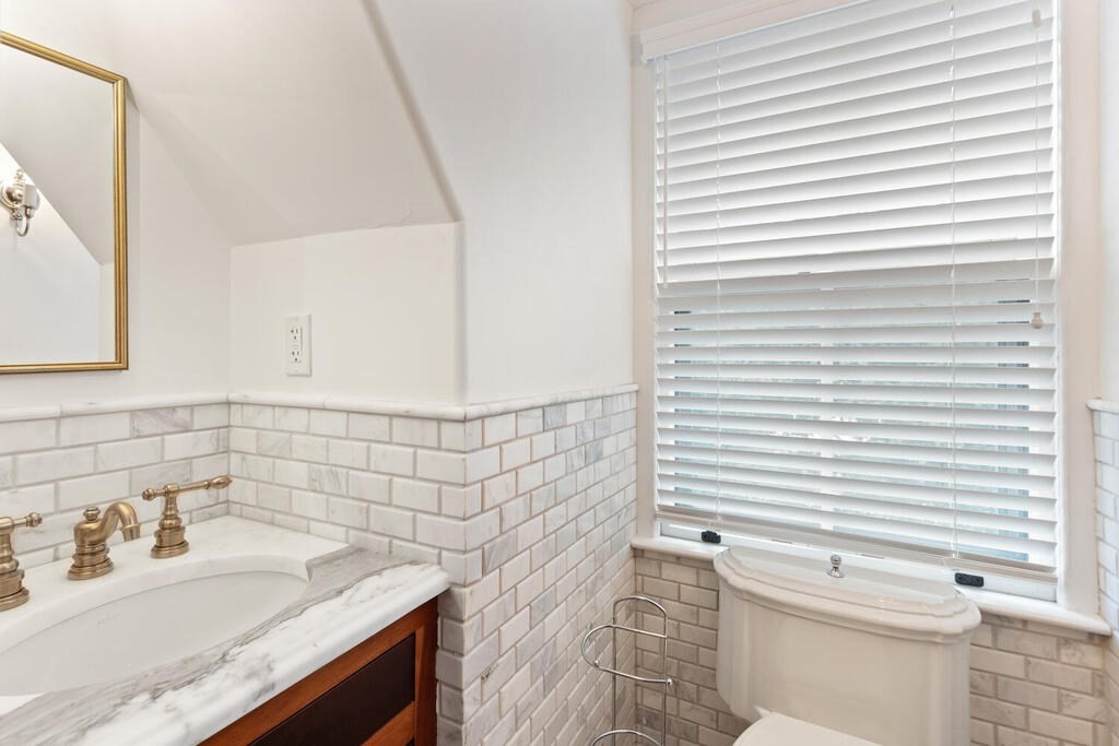 2 Rangeley Road, Unit 2 Winchester, MA 01890 - Photo 24 of 29 a bathroom with a sink a toilet and tub