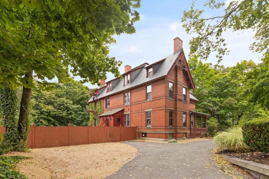 2 Rangeley Road, Unit 2 Winchester, MA 01890 - Photo 25 of 29 a view of a building with a tree