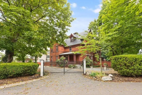a view of a house with a street