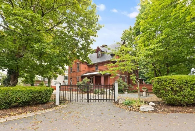 a view of a house with a street