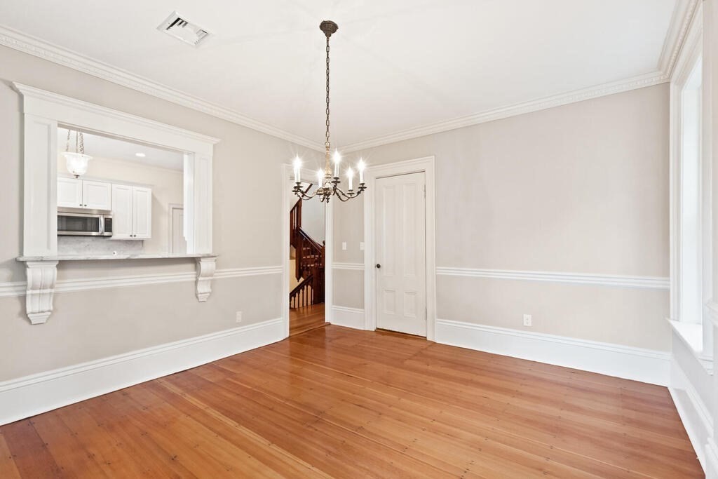 2 Rangeley Road, Unit 2 Winchester, MA 01890 - Photo 10 of 29 a view of a room with wooden floor staircase and a kitchen