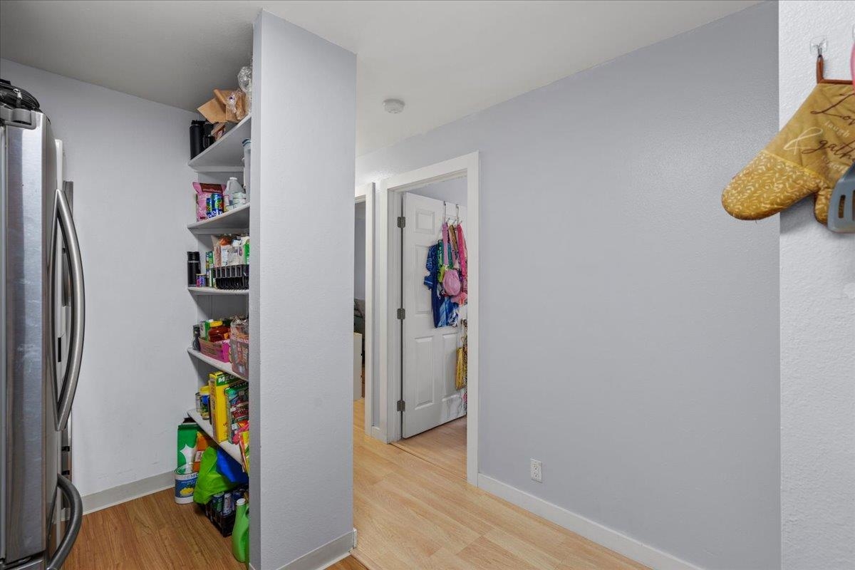 480 Kenolio Road, Unit 1103 Kihei, HI 96753 - Photo 12 of 32 a view of a hallway with painting on the wall and a potted plant