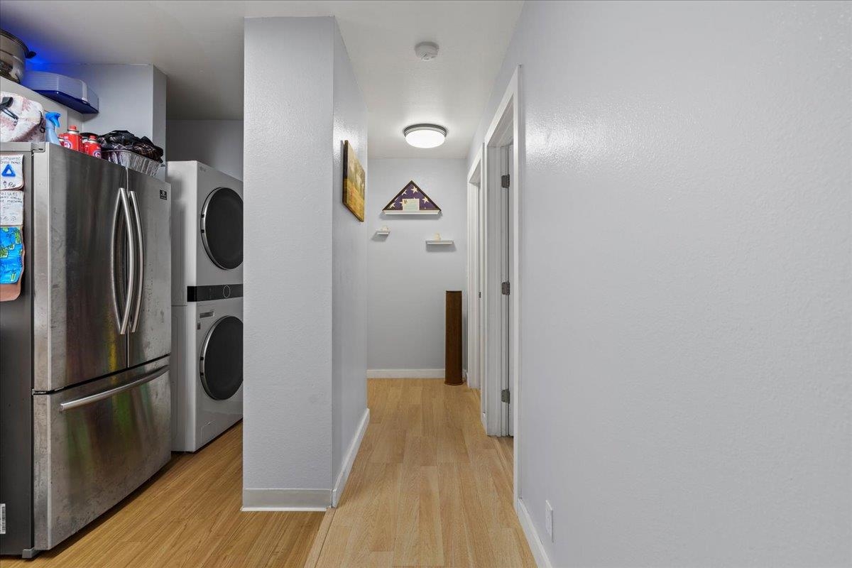 480 Kenolio Road, Unit 1103 Kihei, HI 96753 - Photo 15 of 32 a view of a refrigerator in kitchen and wooden floor