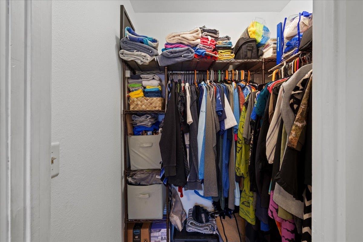 480 Kenolio Road, Unit 1103 Kihei, HI 96753 - Photo 23 of 32 a view of walk in closet with clothes and shoes