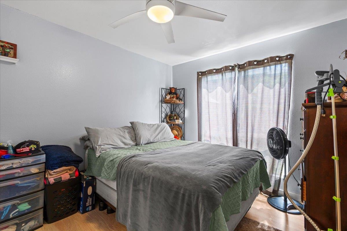 480 Kenolio Road, Unit 1103 Kihei, HI 96753 - Photo 24 of 32 a bedroom with a bed and a window